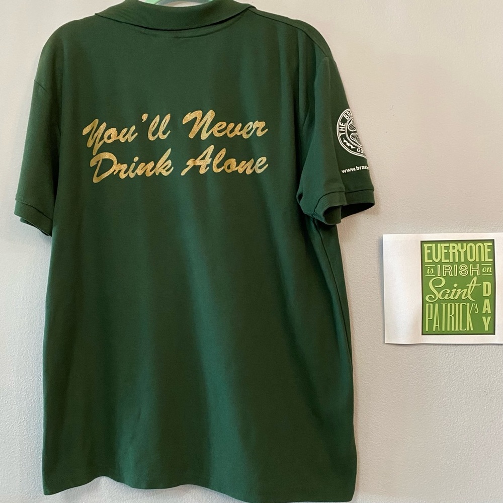 S. Patrick’s Day Pub Graphic Polo Shirt Embroidered “You’ll Never Drink Alone”